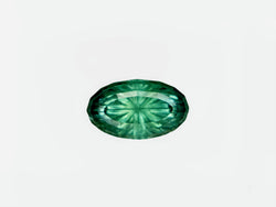 Green gemstone on a white background